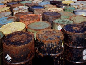 An image of several barrels of hazardous waste