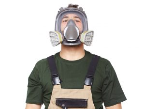 An image of a hazardous waste worker wearing a respirator