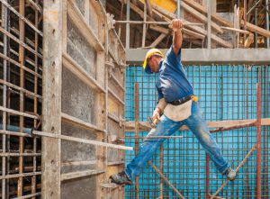 This picture shows a construction worker displaying unsafe work practices, which should be immediately corrected if observed.